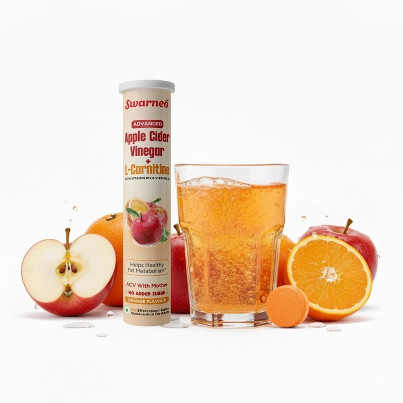 Swerneo Advanced Apple Cider Vinegar with L-Carnitine tablets shown alongside a glass of orange juice, fresh apples, and oranges on a clean white background.